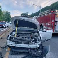 <p>A car went airborne after striking a guardrail on the Saw Mill River Parkway in Dobbs Ferry, landing on two other vehicles.</p>