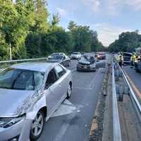 <p>A car went airborne after striking a guardrail on the Saw Mill River Parkway in Dobbs Ferry, landing on two other vehicles.</p>