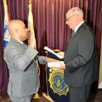 <p>New Westchester County Police Officer Jason Washco taking the oath of office</p>