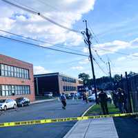 <p>Chunks of a Hawthorne High School parapet gave way Tuesday afternoon, raining bricks and concrete that damaged vehicles parked below.</p>