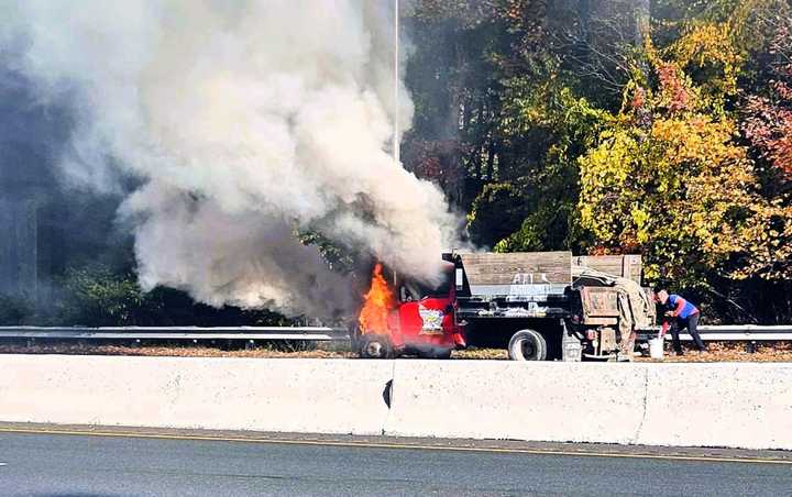 Franklin Lakes firefighters douse a dump truck blaze the morning of Thursday, Oct. 26.