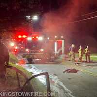 <p>The New Kingstown Fire Company crew at the scene of the car fire with the dead dear still in the road.&nbsp;</p>