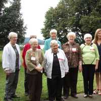 <p>A group of the Dominican Sisters of Hope stand outside on the preserved land along the Hudson River.</p>