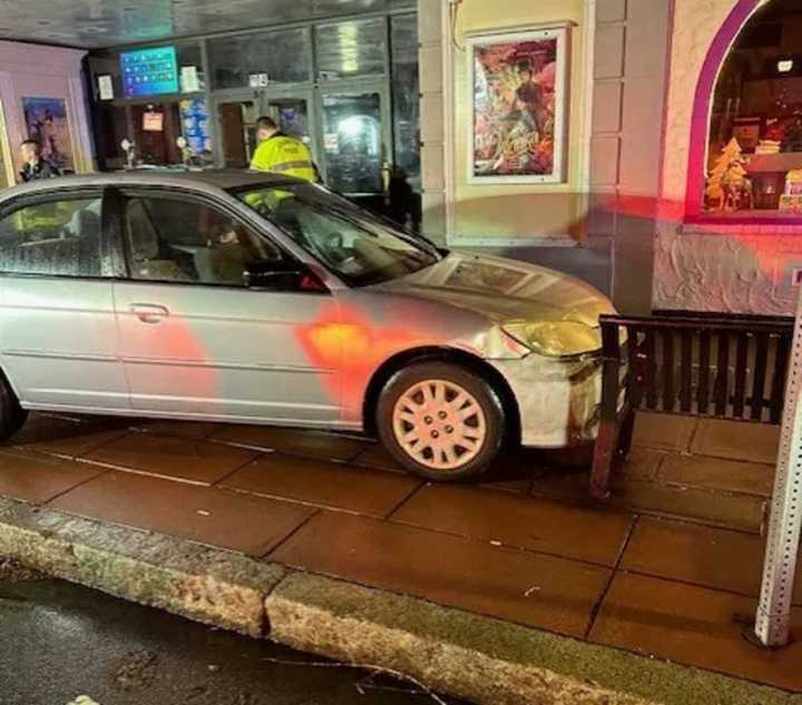 Police say this Honda Civic jumped the curb and crashed after the driver suffered some distress on Thursday night, Dec. 29.&nbsp;