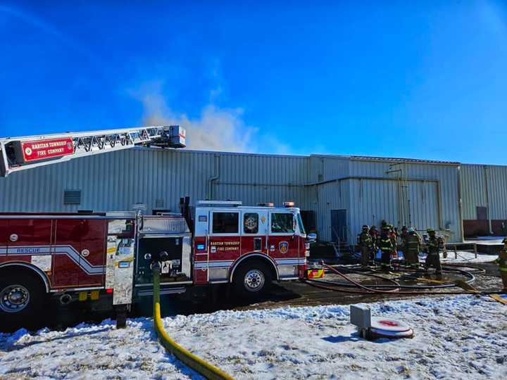 Raritan Township firefighters battled a two-alarm warehouse fire Wednesday.