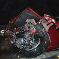 <p>Damage to a red Ford Mustang from a crash in Manchester Township, NJ, on Friday, Jan. 26.</p>