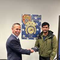 <p>Sinan Mohammad with Suffolk County Police Deputy Commissioner Kevin Catalina.</p>