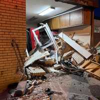 <p>The crash caused serious damage to the firehouse entrance.</p>