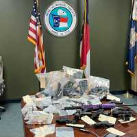 <p>Rowan County deputies found nine handguns, a rifle, ammunition, two bags of methamphetamine, crack cocaine, and marijuana in a vehicle.</p>