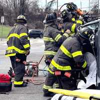 <p>Englewood firefighters freed a passenger in an SUV that got knocked onto its side after the driver ran a red light with her 5-year-old son in the back seat on Sunday, April 7, authorities said.
  
</p>