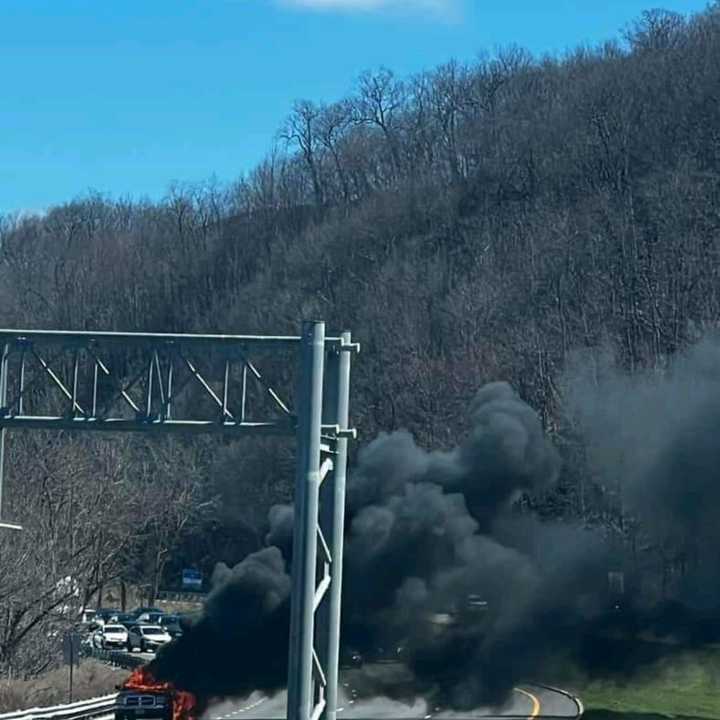 A truck fire billowing smoke on I-80 West.