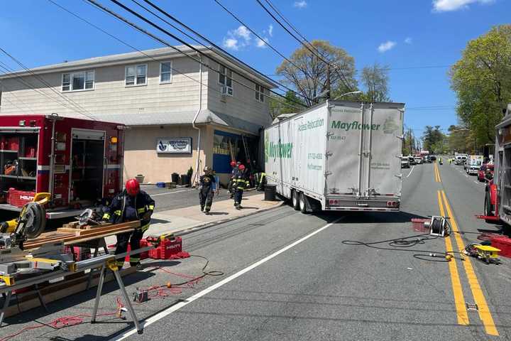 Tractor Trailer Slams Through Building In Three-Vehicle Crash: Cedar Grove PD