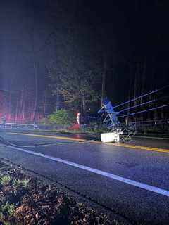 Car Rolls Over, Knocks Down Pole, Wires On Busy Westchester Road