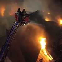 <p>The fire blew through the roof of the second building, with wind fanning the flames.</p>