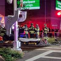 <p>A large crowd gathered as Hackensack firefighters worked intently to free the driver.</p>