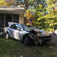 <p>A driver lost control of their vehicle and hit a utility pole and then a house.</p>