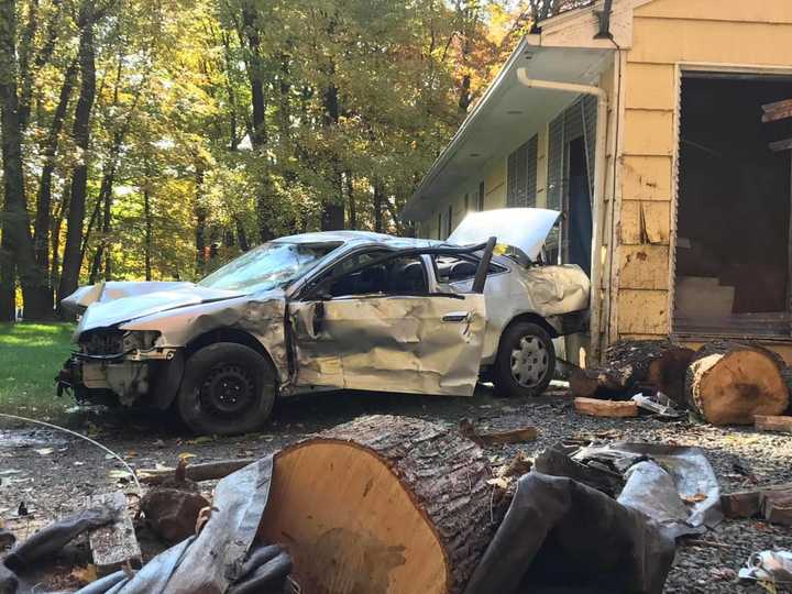 A car crashed into a utility pole and then a house in Chestnut Ridge.