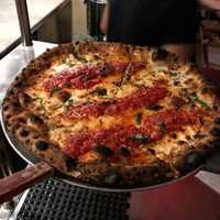 <p>Fiamma Wood Fired Pizza tomato pie.</p>