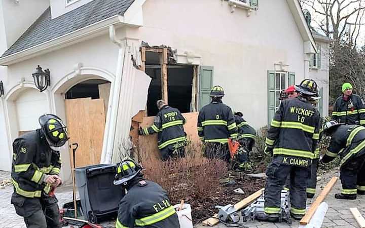 The car ripped through an attached garage.