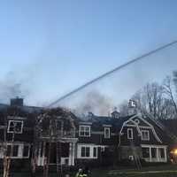 <p>A fire tore through the roof of a Chappaqua mansion over the weekend.</p>