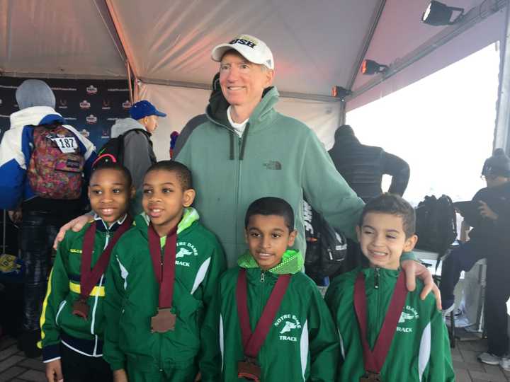 The 4 x 400 relay team that placed  at the indoor national championships with their coach, Joe McMahon from the Yonkers track club. Relay medalists, from left to right, are: Kyle Snow, Aaron Irish Bramble, Sachin Ramharak and Dean Vazquez.