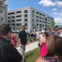 <p>President of PBA Local 49, Chris Weston, speaks to laid off officers and supporters in Hackensack.</p>