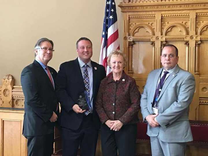 From left, Monroe First Selectman Steve Vavrek, State Representative J.P. Sredzinski, Newtown First Selectman Pat Llodra, DPH Commissioner Dr. Raul Pino