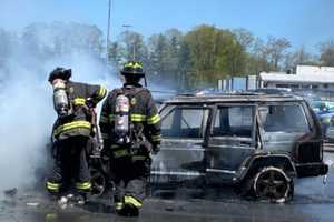 Hero UPS Driver Moves Fiery Jeep Away From Other Cars