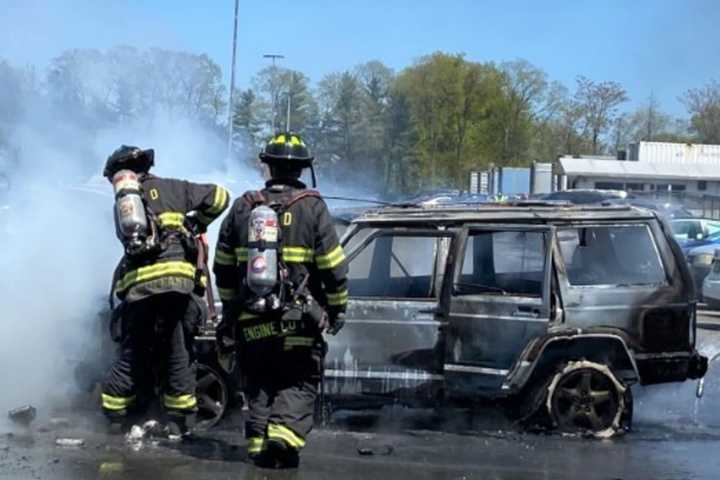 Hero UPS Driver Moves Fiery Jeep Away From Other Cars