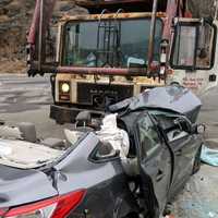 <p>One injured in crash with a garbage truck.</p>