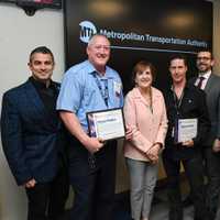 <p>MTA Assistant Conductor Marcus Higgins (second from left) and Locomotive Engineer William Kennedy (third from right) were presented with heroism commendations for their role in the boy&#x27;s rescue.</p>