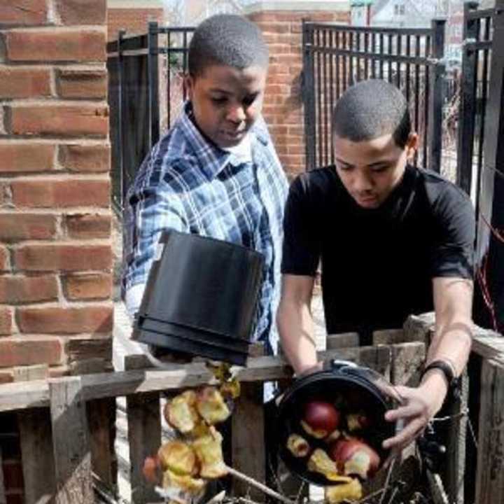 Students compost leftovers from lunch at the Barnard School in New Haven. Twenty-one local schools recently received grants for their recycling efforts from the RecycleCT Foundation.