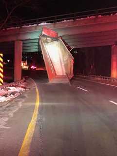 Dump Truck Slams Into Westchester Avenue Overpass