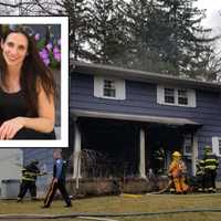 <p>Theresa Kazmierczak with American Bully Ruxpin, who she says community members and firefighters knew to save when her house went up in flames March 22.</p>