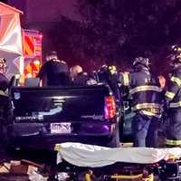 <p>Hackensack firefighters extricated the trapped victim after a pickup truck was rammed by a commuter train at the Central Avenue crossing.</p>