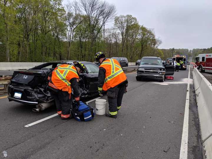 Three people were injured during a three-vehicle crash on the Merritt Parkway.