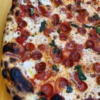 <p>Pepperoni and onion pie from Rosie&#x27;s Pizza in Point Pleasant Beach</p>