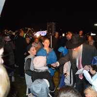 <p>Children sang during the menorah lighting ceremony in Wayne on Tuesday.</p>