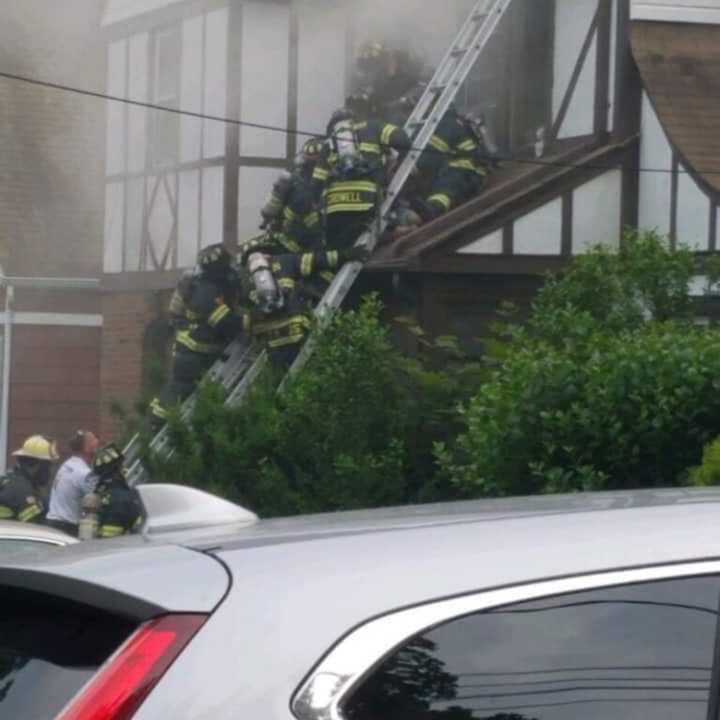 Firefighters at the scene of a deadly blaze in Millburn June 5