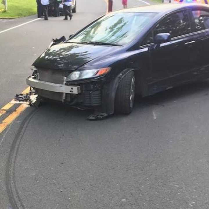 A single-vehicle crash snapped a utility pole.