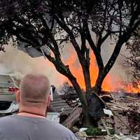 <p>Firefighters continued to battle the flames an hour later.</p>