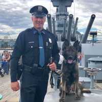 <p>Ryker and his handler, Maywood Police Officer Chris Nichols.</p>