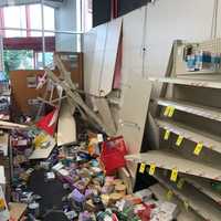 <p>Shelves inside a CVS store hit by a vehicle collapsed from the impact.</p>