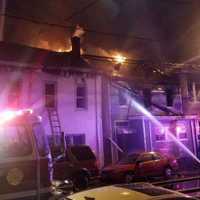 <p>Firefighters battled the Summer Street blaze in Paterson through the night.</p>