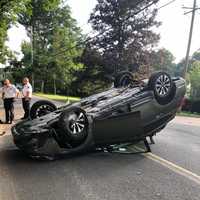 <p>A car overturned in Airmont after striking a retaining wall on a busy street.</p>