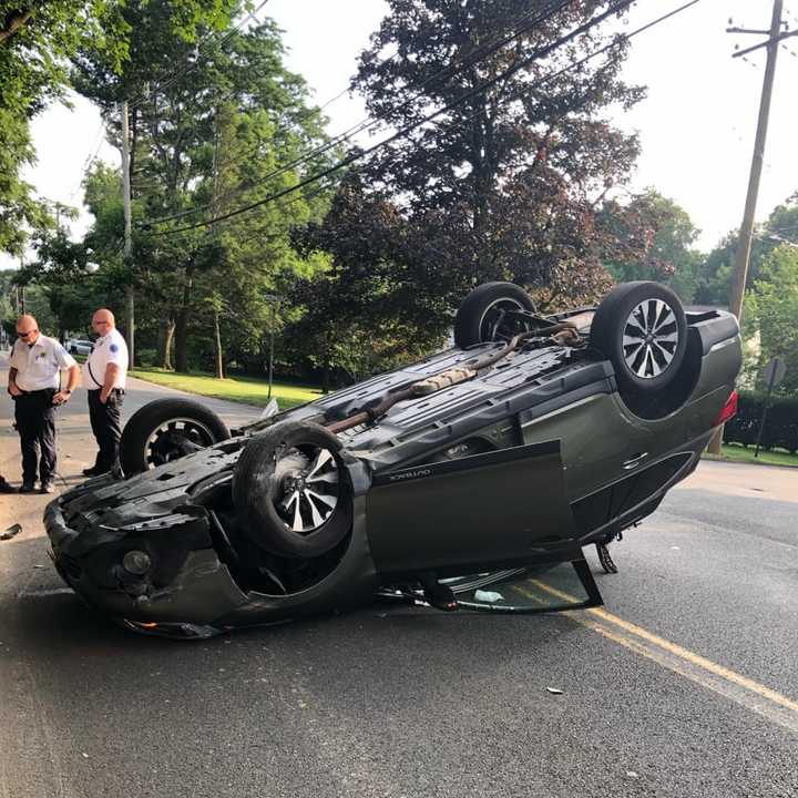 A car overturned in Airmont after striking a retaining wall on a busy street.