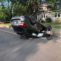 <p>A car overturned in Airmont after striking a retaining wall on a busy street.</p>