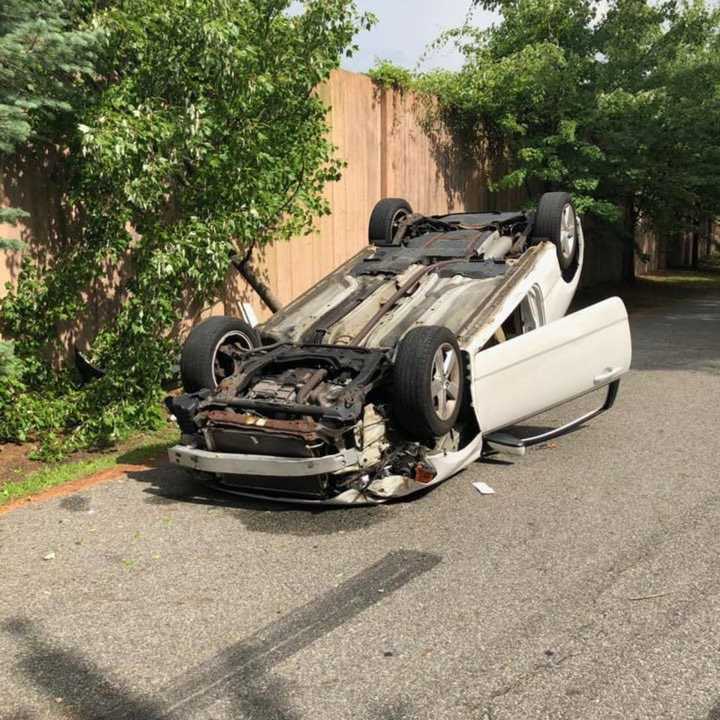 A car overturned in Hillburn as a driver attempted to reach her cellphone after dropping it inside the vehicle.