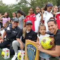 <p>Port Authority police officers based at Newark Airport bought new uniforms for the girls soccer team at East Side High.</p>