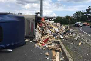 GARBAGE IN, GARBAGE OUT: Trash Truck Overturns In Elizabeth Monday